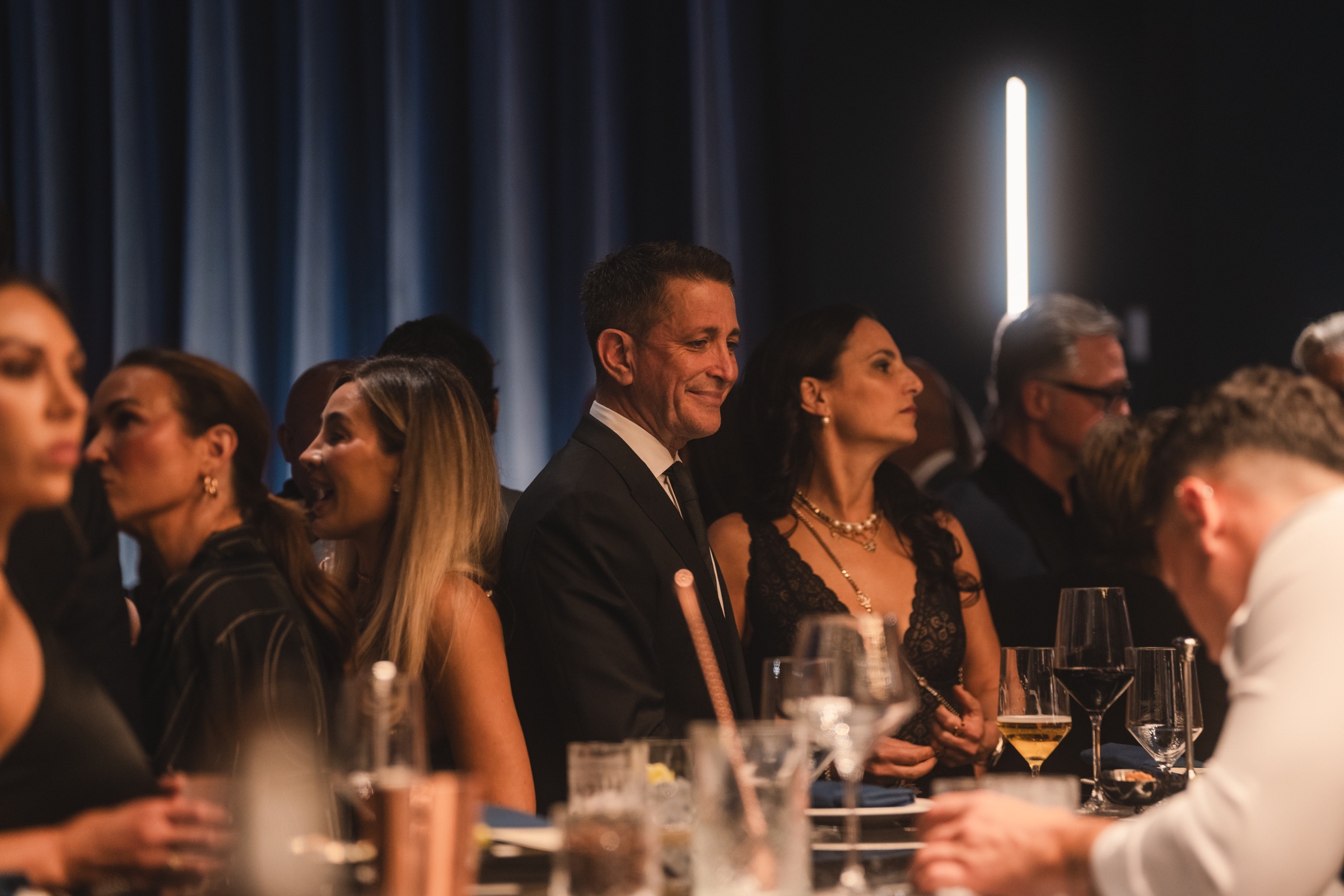 Well-dressed guests sharing an evening around the table